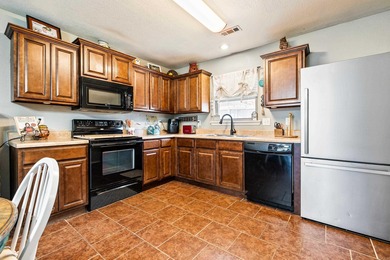 This charming 3 bedroom, 2 bath home is nestled in the highly on Silver Springs Country Club in Arkansas - for sale on GolfHomes.com, golf home, golf lot