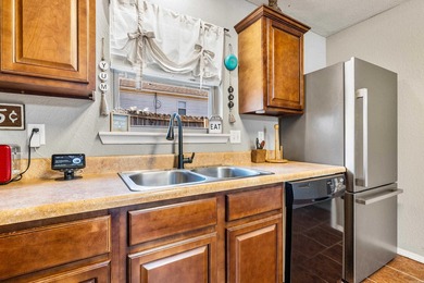 This charming 3 bedroom, 2 bath home is nestled in the highly on Silver Springs Country Club in Arkansas - for sale on GolfHomes.com, golf home, golf lot