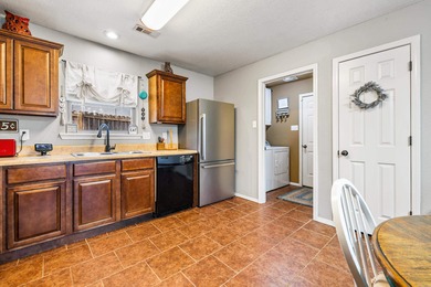 This charming 3 bedroom, 2 bath home is nestled in the highly on Silver Springs Country Club in Arkansas - for sale on GolfHomes.com, golf home, golf lot