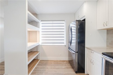 Cozy and modern 2-bedroom, 2-bathroom apartment with a carport on The Glades Golf and Country Club in Florida - for sale on GolfHomes.com, golf home, golf lot