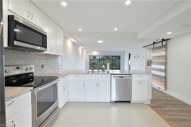 Cozy and modern 2-bedroom, 2-bathroom apartment with a carport on The Glades Golf and Country Club in Florida - for sale on GolfHomes.com, golf home, golf lot