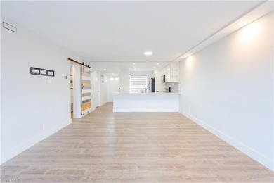 Cozy and modern 2-bedroom, 2-bathroom apartment with a carport on The Glades Golf and Country Club in Florida - for sale on GolfHomes.com, golf home, golf lot