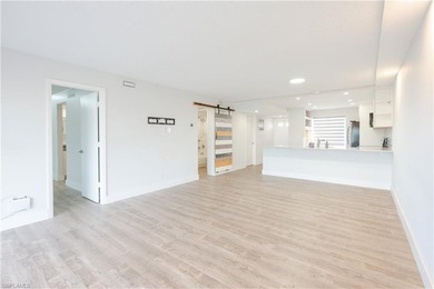 Cozy and modern 2-bedroom, 2-bathroom apartment with a carport on The Glades Golf and Country Club in Florida - for sale on GolfHomes.com, golf home, golf lot