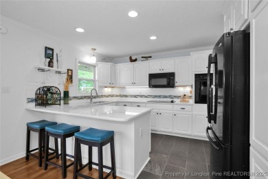 Appraised for $615k. This deceptively large lake front home has on Carolina Trace Country Club in North Carolina - for sale on GolfHomes.com, golf home, golf lot