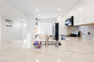 Cozy and modern 2-bedroom, 2-bathroom apartment with a carport on The Glades Golf and Country Club in Florida - for sale on GolfHomes.com, golf home, golf lot