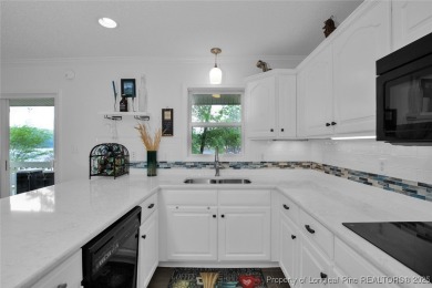 Appraised for $615k. This deceptively large lake front home has on Carolina Trace Country Club in North Carolina - for sale on GolfHomes.com, golf home, golf lot