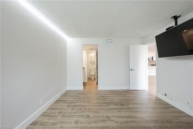 Cozy and modern 2-bedroom, 2-bathroom apartment with a carport on The Glades Golf and Country Club in Florida - for sale on GolfHomes.com, golf home, golf lot