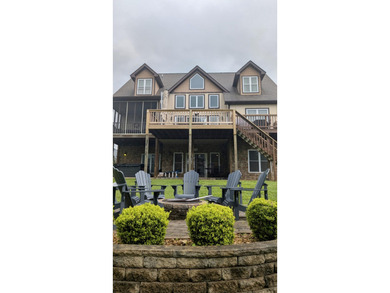 Luxury custom built lake lodge nestled alongside the shore of on Woodson Bend Resort in Kentucky - for sale on GolfHomes.com, golf home, golf lot