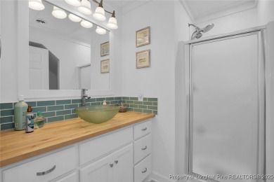 Appraised for $615k. This deceptively large lake front home has on Carolina Trace Country Club in North Carolina - for sale on GolfHomes.com, golf home, golf lot