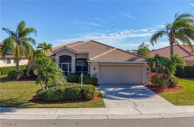 This beautifully maintained LAKEFRONT Sandpiper model home in on Herons Glen Golf and Country Club in Florida - for sale on GolfHomes.com, golf home, golf lot
