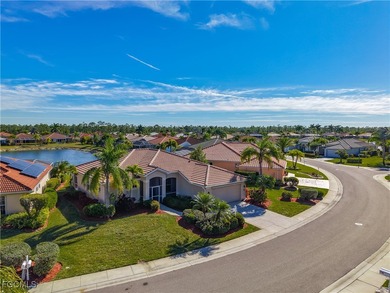 This beautifully maintained LAKEFRONT Sandpiper model home in on Herons Glen Golf and Country Club in Florida - for sale on GolfHomes.com, golf home, golf lot