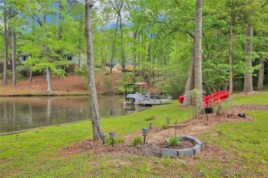 Appraised for $615k. This deceptively large lake front home has on Carolina Trace Country Club in North Carolina - for sale on GolfHomes.com, golf home, golf lot