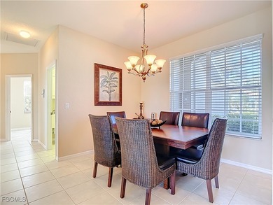 This beautifully maintained LAKEFRONT Sandpiper model home in on Herons Glen Golf and Country Club in Florida - for sale on GolfHomes.com, golf home, golf lot
