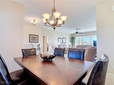 This beautifully maintained LAKEFRONT Sandpiper model home in on Herons Glen Golf and Country Club in Florida - for sale on GolfHomes.com, golf home, golf lot