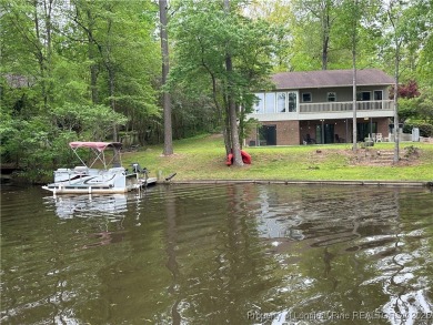 Appraised for $615k. This deceptively large lake front home has on Carolina Trace Country Club in North Carolina - for sale on GolfHomes.com, golf home, golf lot