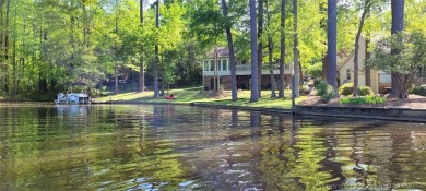 Appraised for $615k. This deceptively large lake front home has on Carolina Trace Country Club in North Carolina - for sale on GolfHomes.com, golf home, golf lot