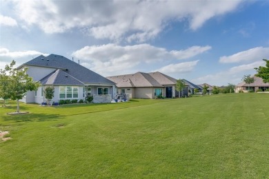 Discover the rare opportunity to own a two-story Ashland model on Wildhorse Golf Club of Robson Ranch in Texas - for sale on GolfHomes.com, golf home, golf lot