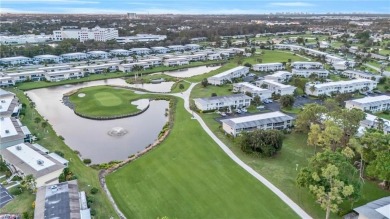 Discover this beautiful move-in-ready first-floor end unit in on The Glades Golf and Country Club in Florida - for sale on GolfHomes.com, golf home, golf lot