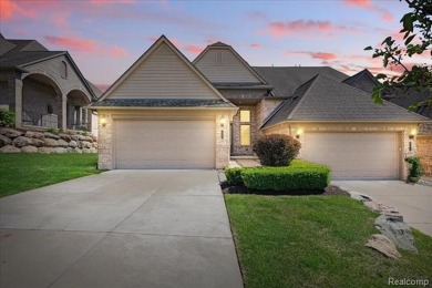 Enjoy maintenance-free golf course living on the first green of on Pine Knob Golf Club - Hawk in Michigan - for sale on GolfHomes.com, golf home, golf lot