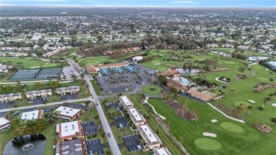 Discover this beautiful move-in-ready first-floor end unit in on The Glades Golf and Country Club in Florida - for sale on GolfHomes.com, golf home, golf lot