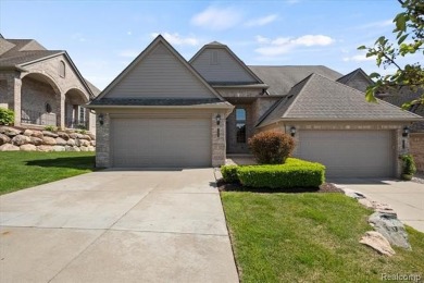 Enjoy maintenance-free golf course living on the first green of on Pine Knob Golf Club - Hawk in Michigan - for sale on GolfHomes.com, golf home, golf lot