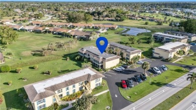 Discover this beautiful move-in-ready first-floor end unit in on The Glades Golf and Country Club in Florida - for sale on GolfHomes.com, golf home, golf lot