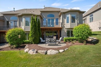 Enjoy maintenance-free golf course living on the first green of on Pine Knob Golf Club - Hawk in Michigan - for sale on GolfHomes.com, golf home, golf lot