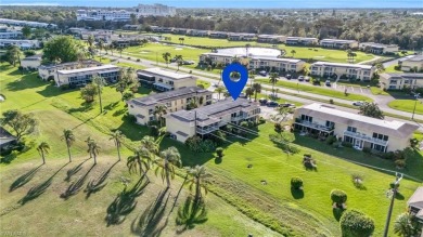 Discover this beautiful move-in-ready first-floor end unit in on The Glades Golf and Country Club in Florida - for sale on GolfHomes.com, golf home, golf lot