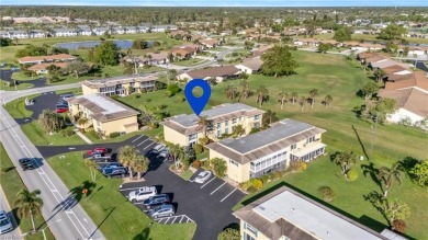 Discover this beautiful move-in-ready first-floor end unit in on The Glades Golf and Country Club in Florida - for sale on GolfHomes.com, golf home, golf lot