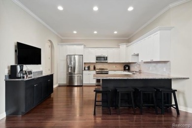 Enjoy maintenance-free golf course living on the first green of on Pine Knob Golf Club - Hawk in Michigan - for sale on GolfHomes.com, golf home, golf lot