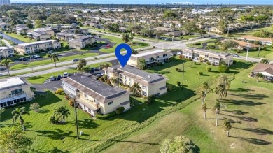 Discover this beautiful move-in-ready first-floor end unit in on The Glades Golf and Country Club in Florida - for sale on GolfHomes.com, golf home, golf lot