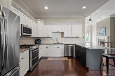 Enjoy maintenance-free golf course living on the first green of on Pine Knob Golf Club - Hawk in Michigan - for sale on GolfHomes.com, golf home, golf lot