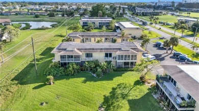 Discover this beautiful move-in-ready first-floor end unit in on The Glades Golf and Country Club in Florida - for sale on GolfHomes.com, golf home, golf lot