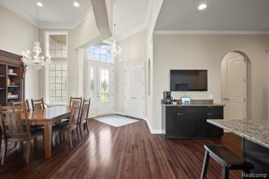 Enjoy maintenance-free golf course living on the first green of on Pine Knob Golf Club - Hawk in Michigan - for sale on GolfHomes.com, golf home, golf lot