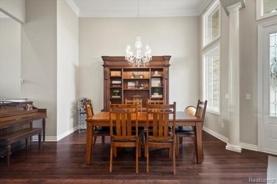 Enjoy maintenance-free golf course living on the first green of on Pine Knob Golf Club - Hawk in Michigan - for sale on GolfHomes.com, golf home, golf lot