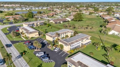 Discover this beautiful move-in-ready first-floor end unit in on The Glades Golf and Country Club in Florida - for sale on GolfHomes.com, golf home, golf lot