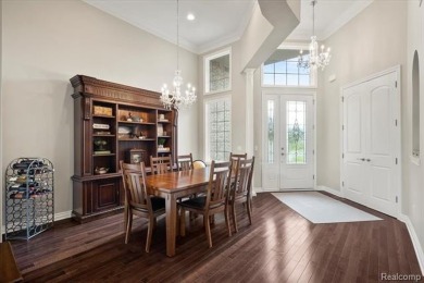 Enjoy maintenance-free golf course living on the first green of on Pine Knob Golf Club - Hawk in Michigan - for sale on GolfHomes.com, golf home, golf lot