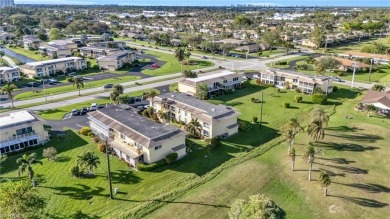 Discover this beautiful move-in-ready first-floor end unit in on The Glades Golf and Country Club in Florida - for sale on GolfHomes.com, golf home, golf lot