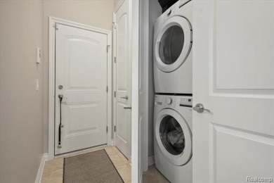 Enjoy maintenance-free golf course living on the first green of on Pine Knob Golf Club - Hawk in Michigan - for sale on GolfHomes.com, golf home, golf lot