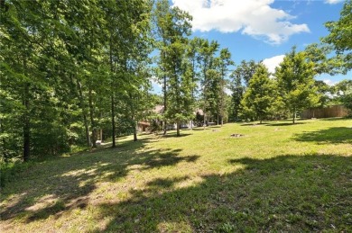 Tucked away in the cul-de-sac and spanning 2 lots, this stunning on Bella Vista - Metfield Golf Complex and Country Club in Arkansas - for sale on GolfHomes.com, golf home, golf lot