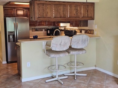 Squeaky clean and priced to sell!   Pet friendly and leasing is on Village Green Golf Club of Sarasota in Florida - for sale on GolfHomes.com, golf home, golf lot