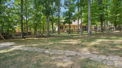 Welcome home to this beautiful brick residence in desirable on The Divide Golf Club in North Carolina - for sale on GolfHomes.com, golf home, golf lot