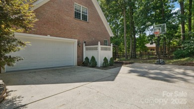 Welcome home to this beautiful brick residence in desirable on The Divide Golf Club in North Carolina - for sale on GolfHomes.com, golf home, golf lot