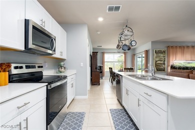 Welcome to this 2023-built home located on a premium lot backing on Herons Glen Golf and Country Club in Florida - for sale on GolfHomes.com, golf home, golf lot