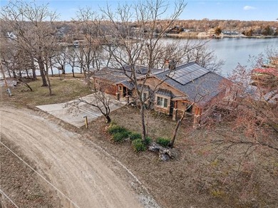 This lake front home in sought after Sugar Valley Lakes sits on on Sugar Valley Lakes Golf Course in Kansas - for sale on GolfHomes.com, golf home, golf lot