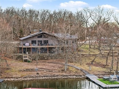This lake front home in sought after Sugar Valley Lakes sits on on Sugar Valley Lakes Golf Course in Kansas - for sale on GolfHomes.com, golf home, golf lot
