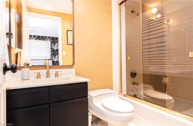 This spacious 2-bedroom, 2.5-bathroom residence with a den on Club at Pelican Bay Golf Course in Florida - for sale on GolfHomes.com, golf home, golf lot