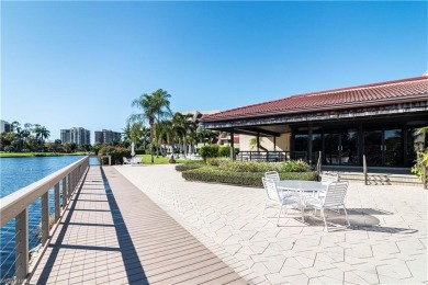 This spacious 2-bedroom, 2.5-bathroom residence with a den on Club at Pelican Bay Golf Course in Florida - for sale on GolfHomes.com, golf home, golf lot