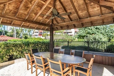 This spacious 2-bedroom, 2.5-bathroom residence with a den on Club at Pelican Bay Golf Course in Florida - for sale on GolfHomes.com, golf home, golf lot