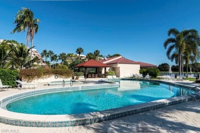 This spacious 2-bedroom, 2.5-bathroom residence with a den on Club at Pelican Bay Golf Course in Florida - for sale on GolfHomes.com, golf home, golf lot